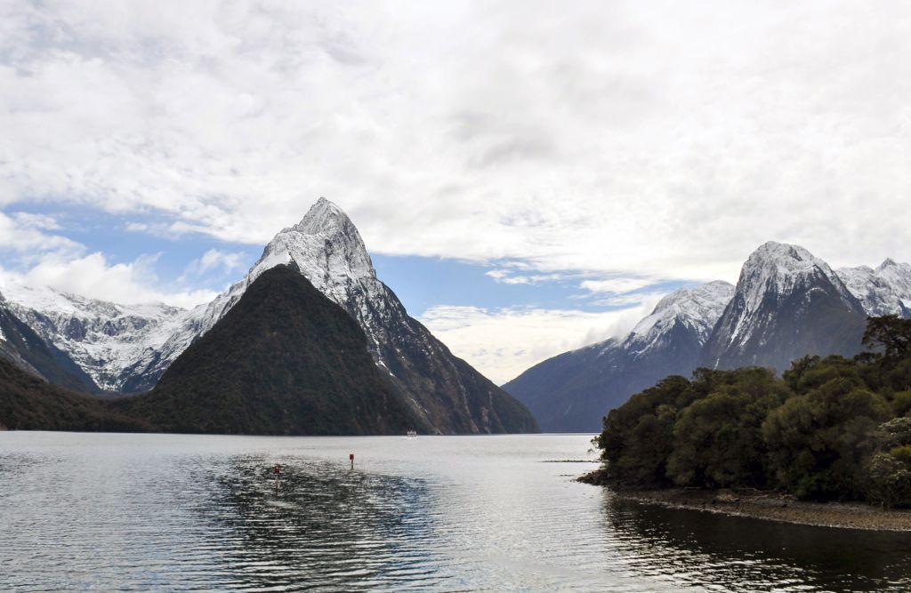 The Best Time to Visit Milford Sound Milford Sound mountain peaks and waterfalls